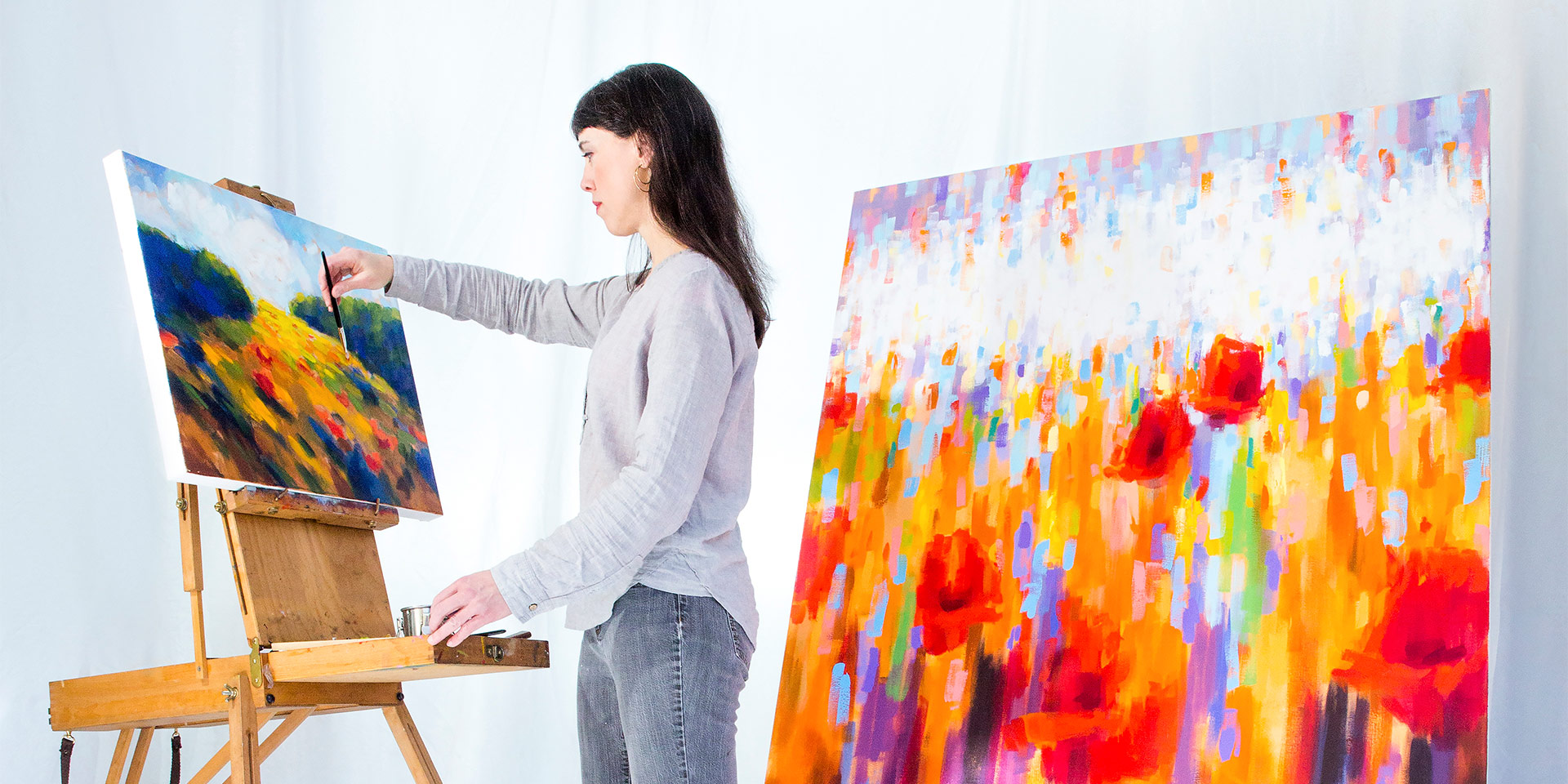 a girl working on two paintings