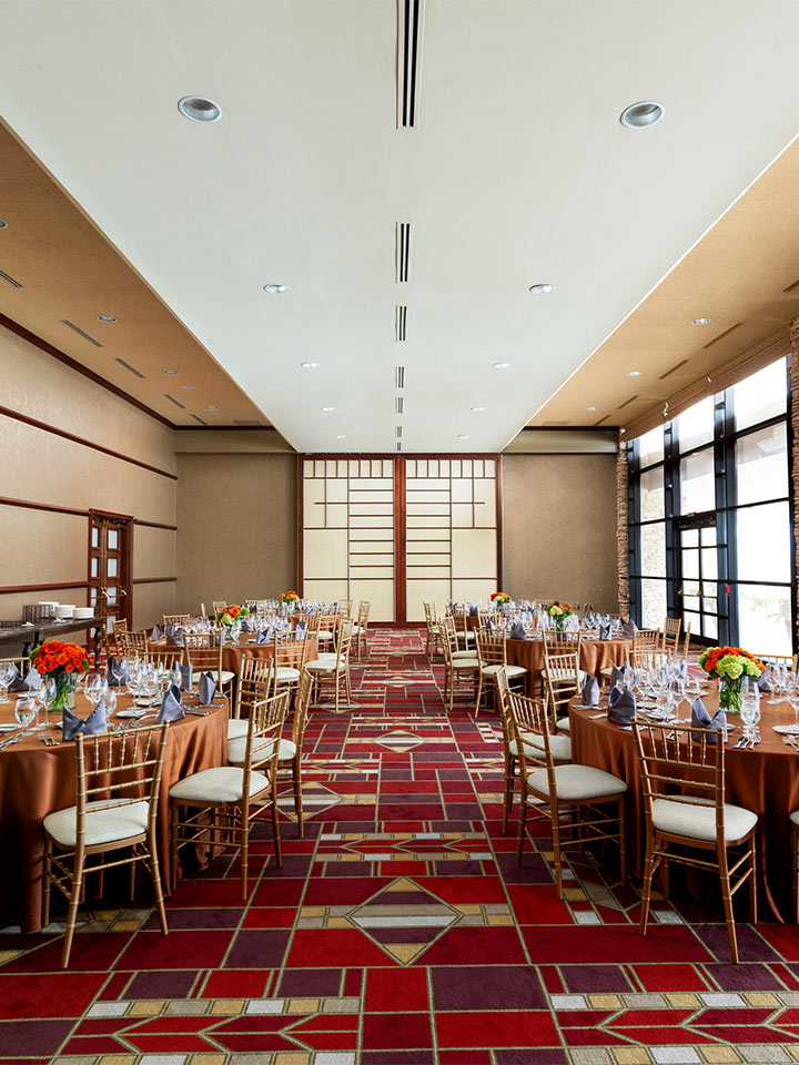 large dining room with red patterned carpet