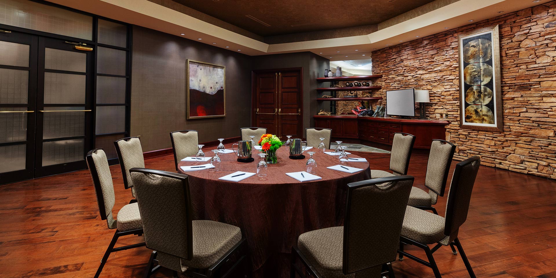 round table setting in a small room with greenish walls